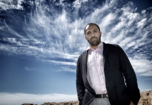Ritesh Batra standing in front of a blue sky